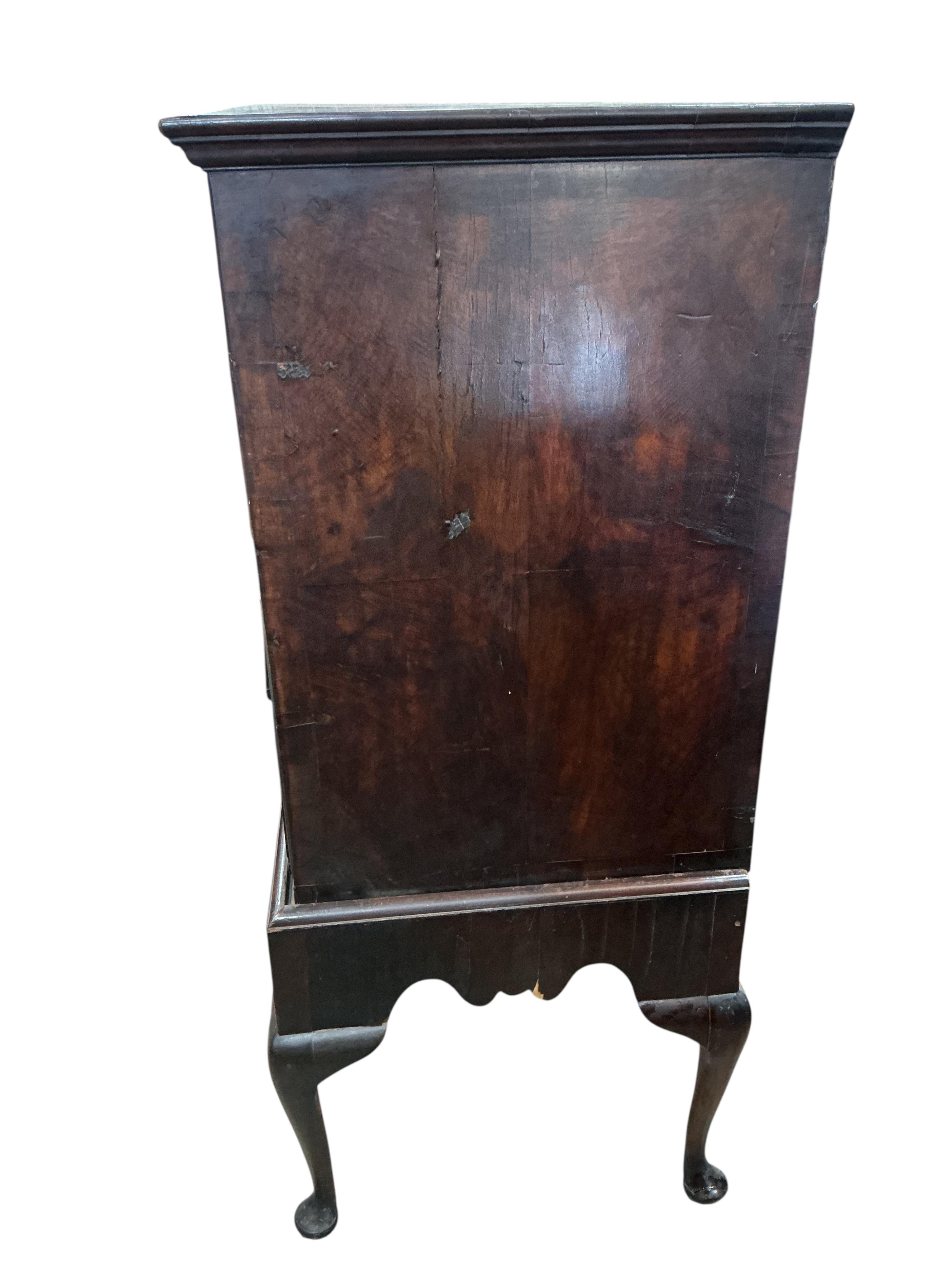 An 18th century banded walnut chest on stand, width 98cm, depth 54cm, height 131cm